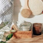 Eco Product - brown wooden chopping board beside clear glass jar