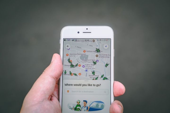Travel App - person holding silver iPhone 6