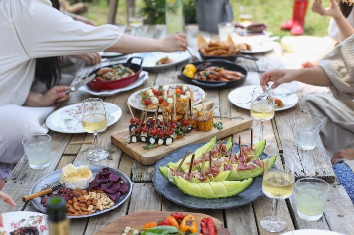Wine Meal - group of people eating on backyard