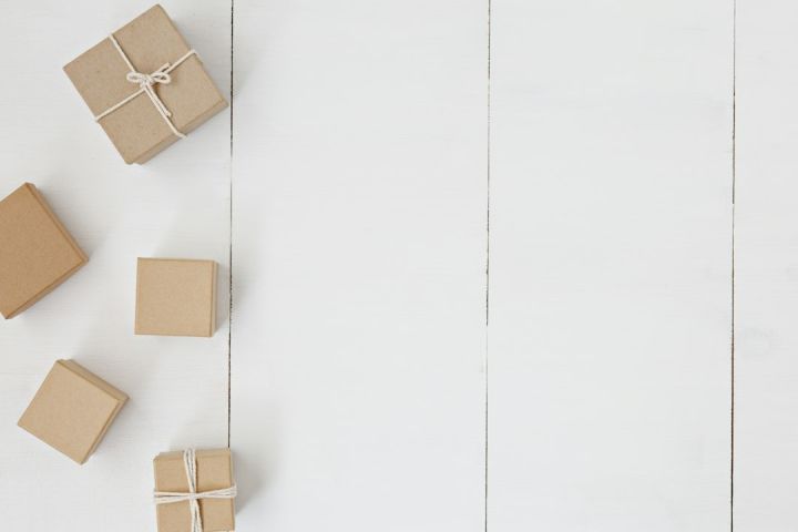 Gift Office - brown gift box on white surface
