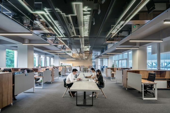 Tech Companies - man and woman sitting on table