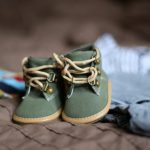 Kids Clothes - Baby's Green and Beige Sneakers on Brown Textile