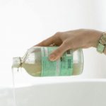 Skin Care - Person Pouring Aromatic Soap On Water