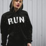 Sportswear - Woman Wearing Black and White Run-printed Pullover Hoodie